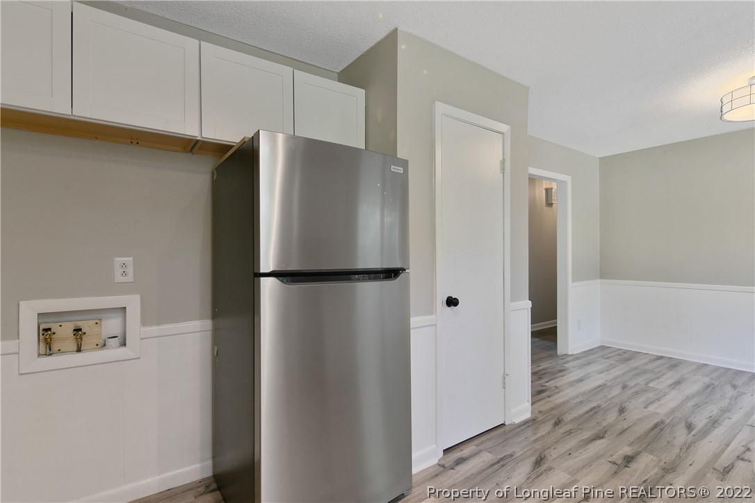 711 Bronco Road Fayetteville, NC 28303 - Photo 20 of 42 a metallic refrigerator freezer sitting in a kitchen