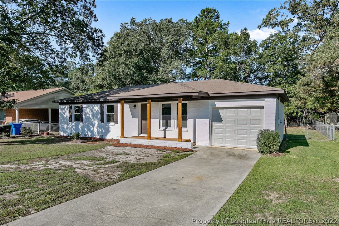 711 Bronco Road Fayetteville, NC 28303 - Photo 3 of 42 a front view of a house with a garden