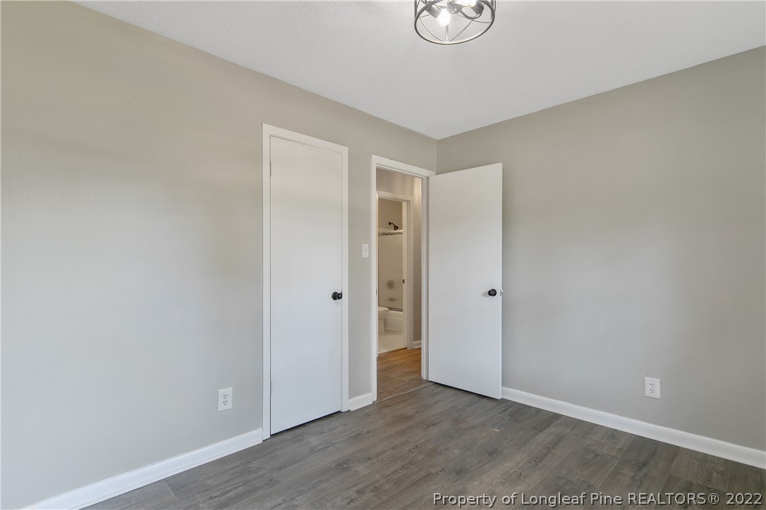 711 Bronco Road Fayetteville, NC 28303 - Photo 37 of 42 a view of room with wooden floor