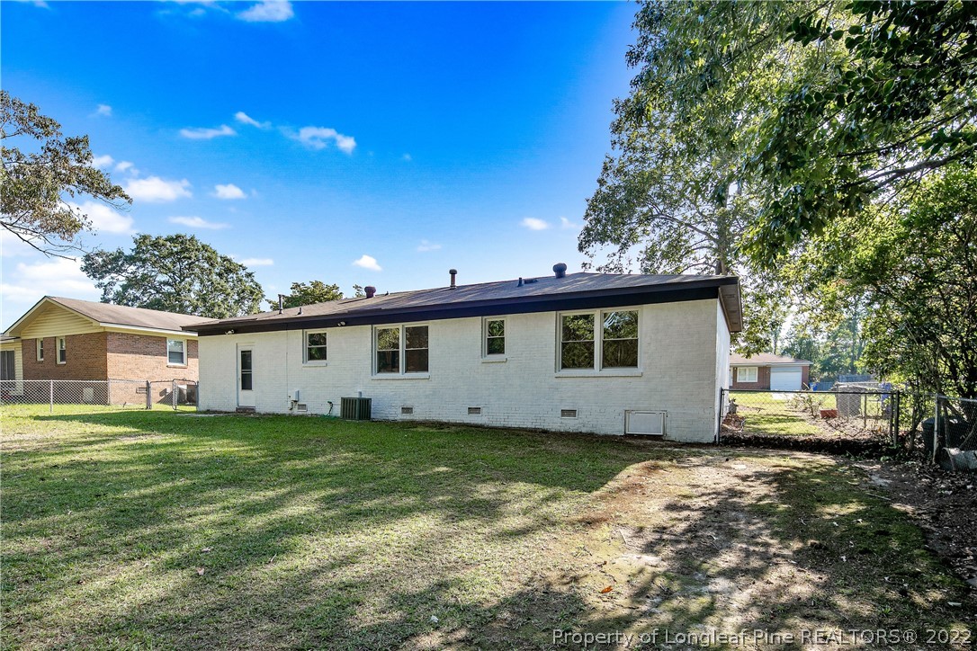 711 Bronco Road Fayetteville, NC 28303 - Photo 41 of 42 a view of a house with a big yard