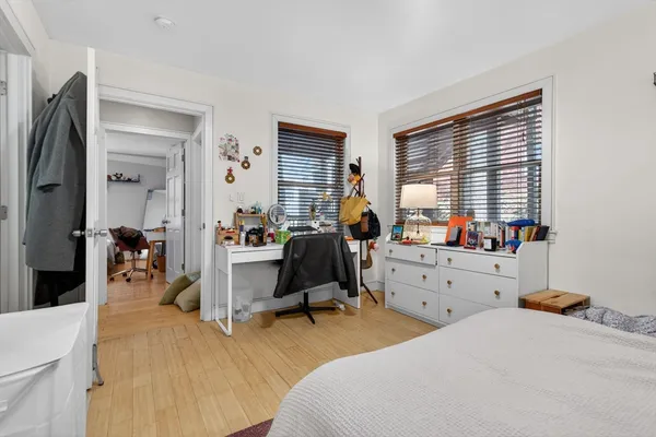 a bed room with a bed and a window