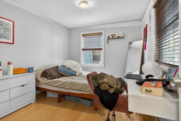 a bedroom with furniture and a window