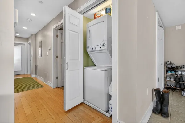 a view of a hallway with storage and utility