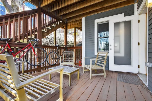 a view of a balcony with wooden floor