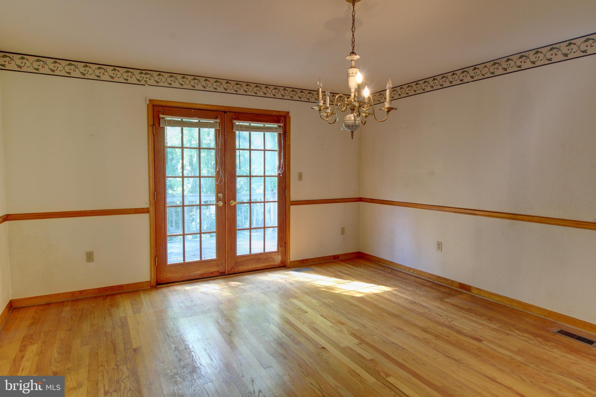669 Gid Brown Hollow Road Washington, VA 22747 - Photo 13 of 54 French doors from dining room to wraparound deck