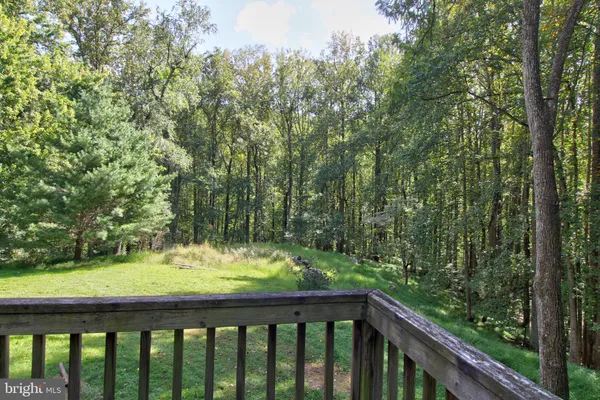 a balcony with trees in front of it