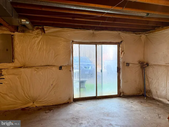 a view of a yard with potted plants