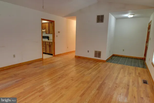 a view of an empty room and window