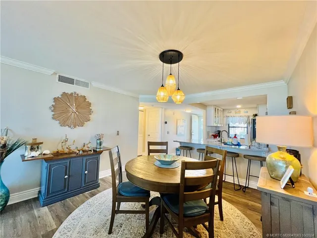 a bedroom with furniture and a large window