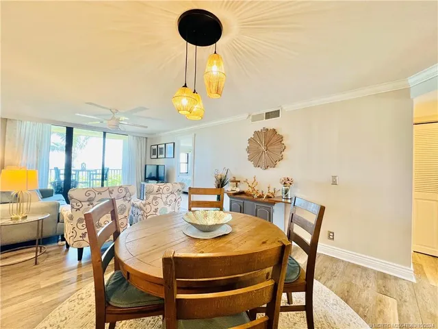a bedroom with furniture and a wooden floor