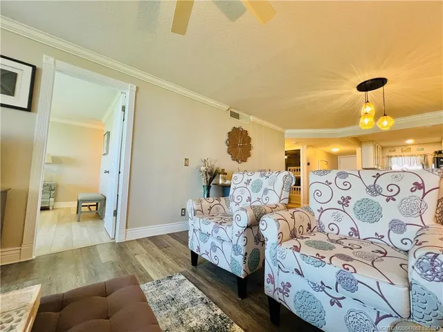 a view of a chairs and table in patio
