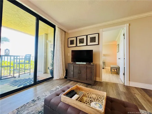 a view of a patio with a table and chairs