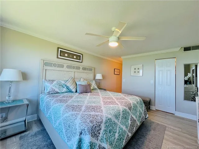 a en suite bathroom with a granite countertop sink and a mirror
