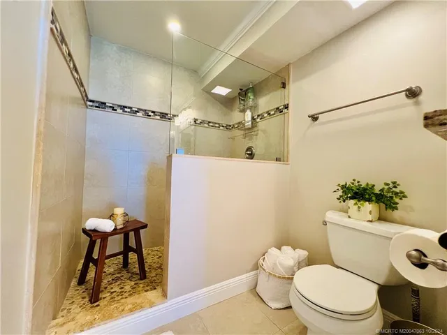 a bedroom with a bed and a night stand