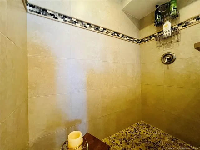 a bedroom with a bed and a desk