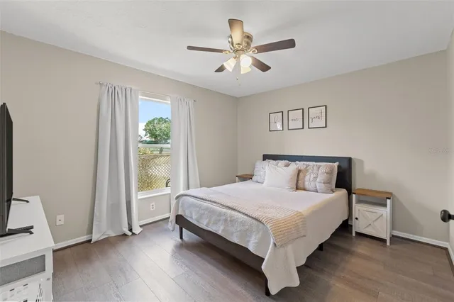 a bed sitting in a bedroom next to a window