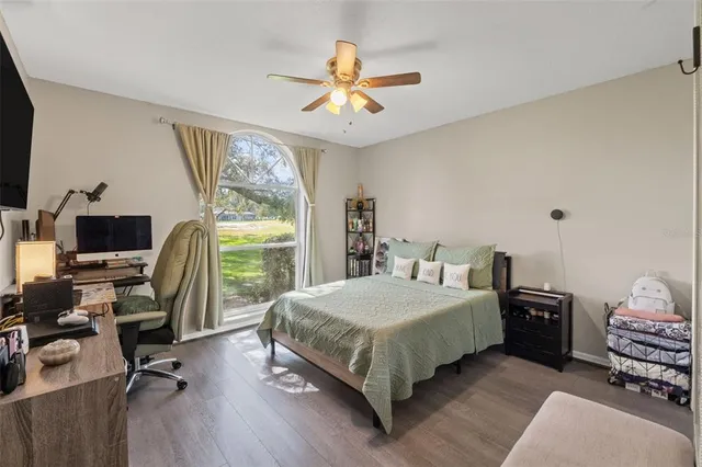 a bedroom with a bed and a desk