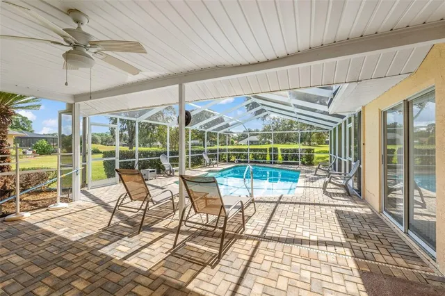 a view of a living room and balcony with furniture