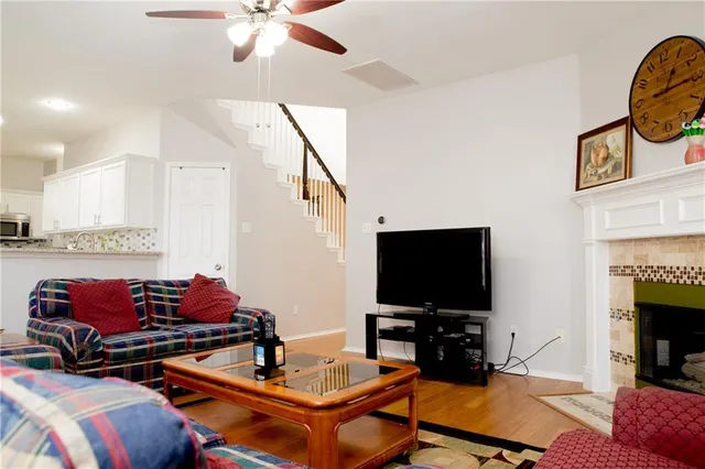 a living room with furniture and a flat screen tv