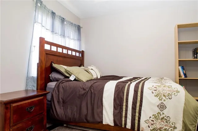 a bedroom with a bed and a cabinets