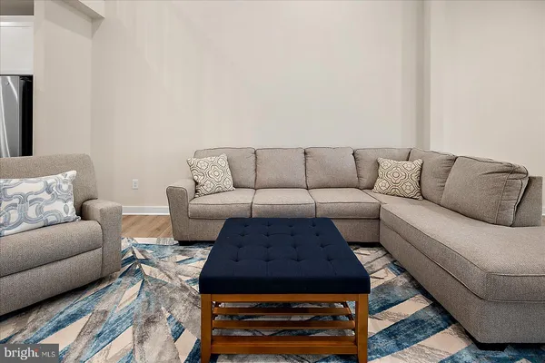 a living room with furniture and a couch