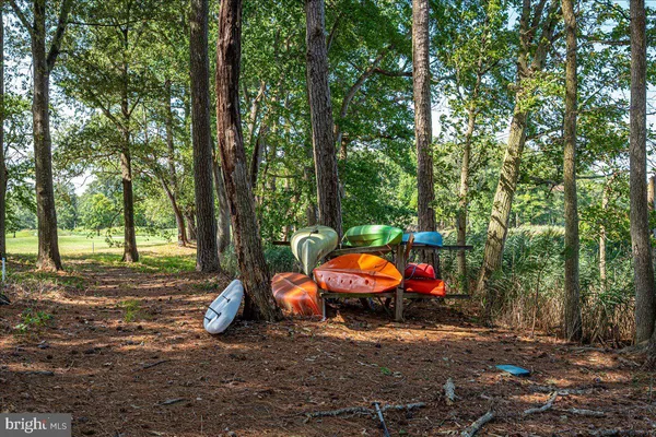 a view of a patio with table and chairs and potted plants
