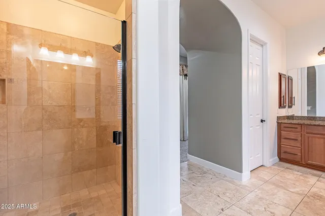 a view of a bathroom with a shower and a sink