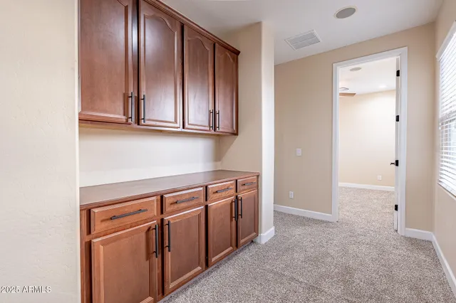 a view of cabinets with wooden floor