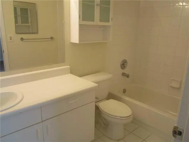 a bathroom with a toilet and shower