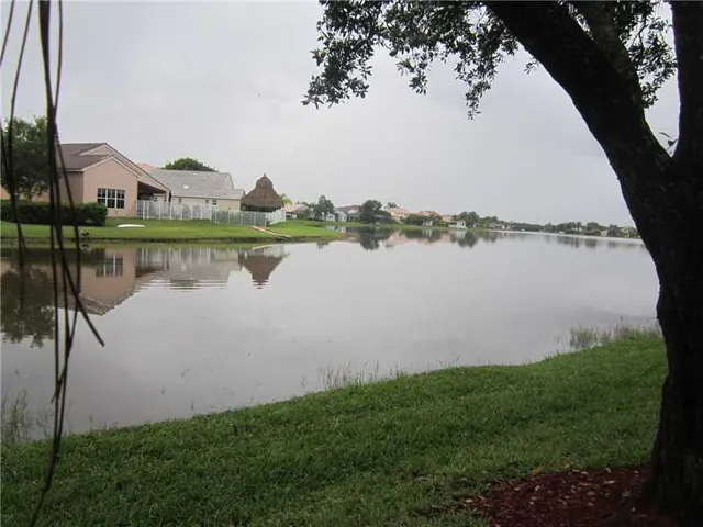 a view of a lake with houses in the back