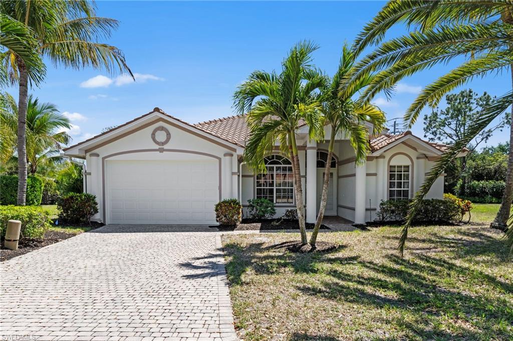 9623 Springlake Circle Estero, FL 33928 - Photo 1 of 47 a front view of a house with a yard