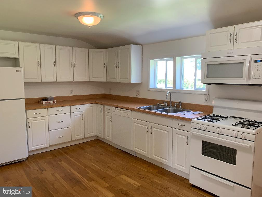 6 Williams Street Glassboro, NJ 08028 - Photo 4 of 11 a kitchen with granite countertop white cabinets and white appliances