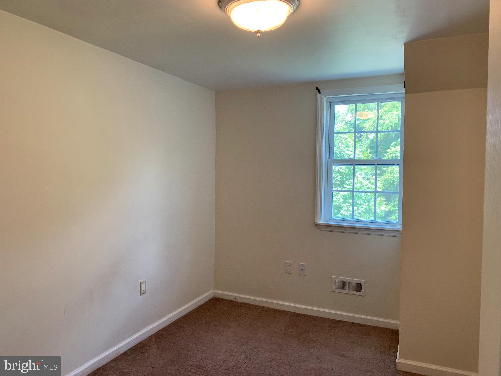 6 Williams Street Glassboro, NJ 08028 - Photo 7 of 11 an empty room with a window and a fan