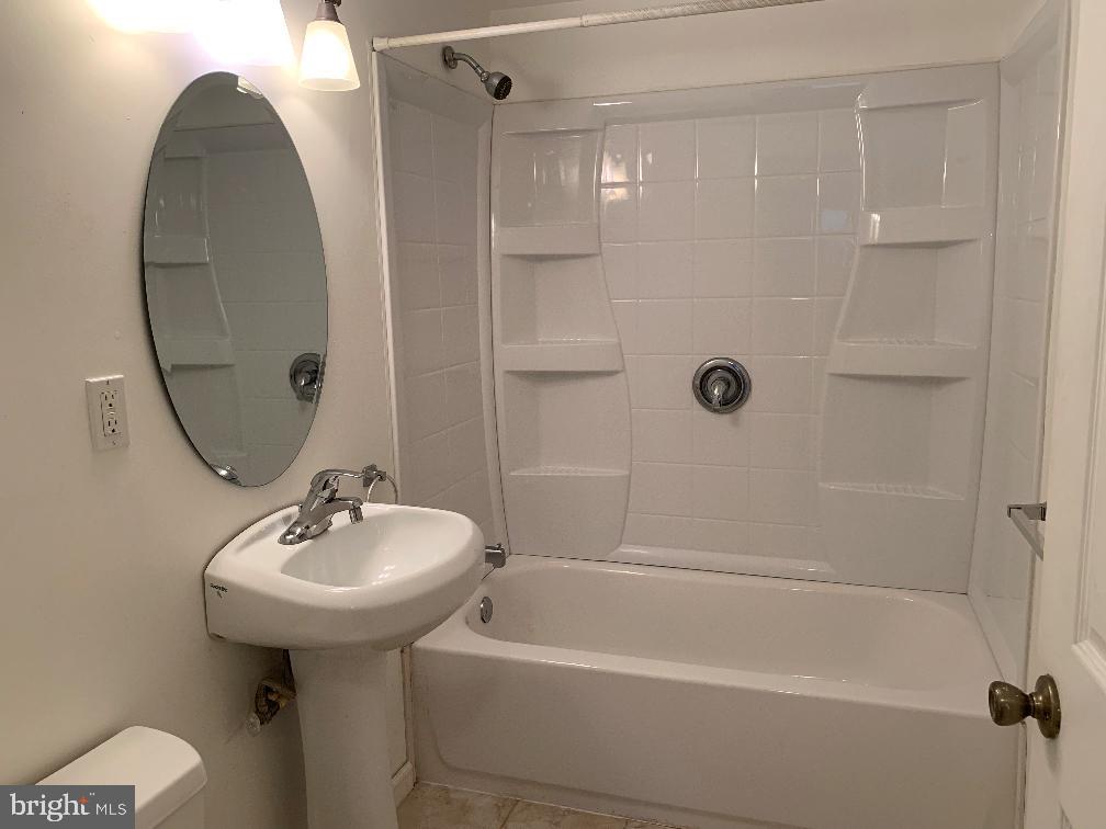 6 Williams Street Glassboro, NJ 08028 - Photo 10 of 11 a bathroom with a sink a mirror and a bathtub