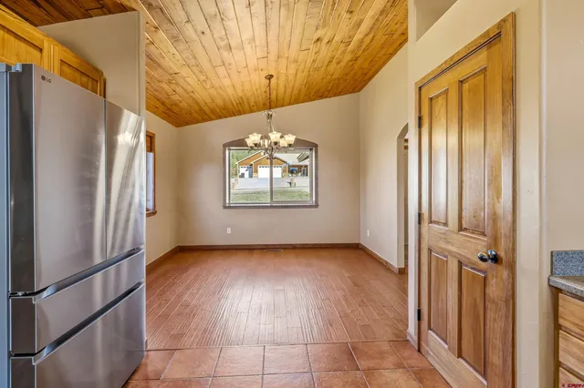 a view of a hallway with windows