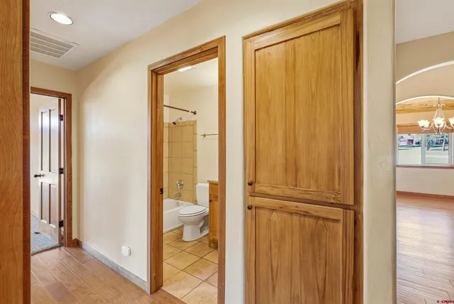 a view of a bathroom from the hallway