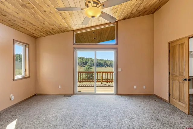 a view of a room with window and chandelier