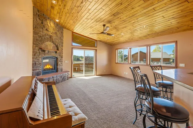 a view of a livingroom with furniture wooden floor and windows
