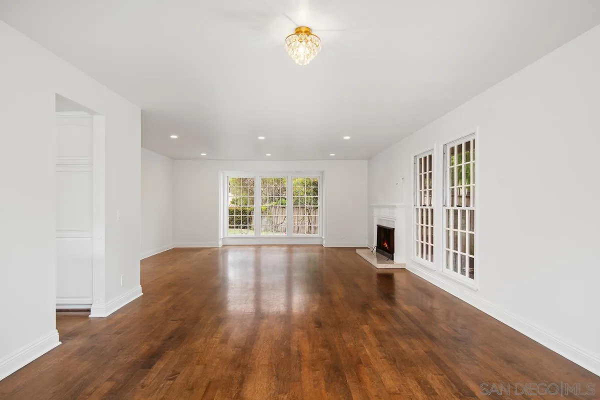 6229 La Jolla Mesa Drive La Jolla, CA 92037 - Photo 12 of 39 wooden floor in an empty room with a window