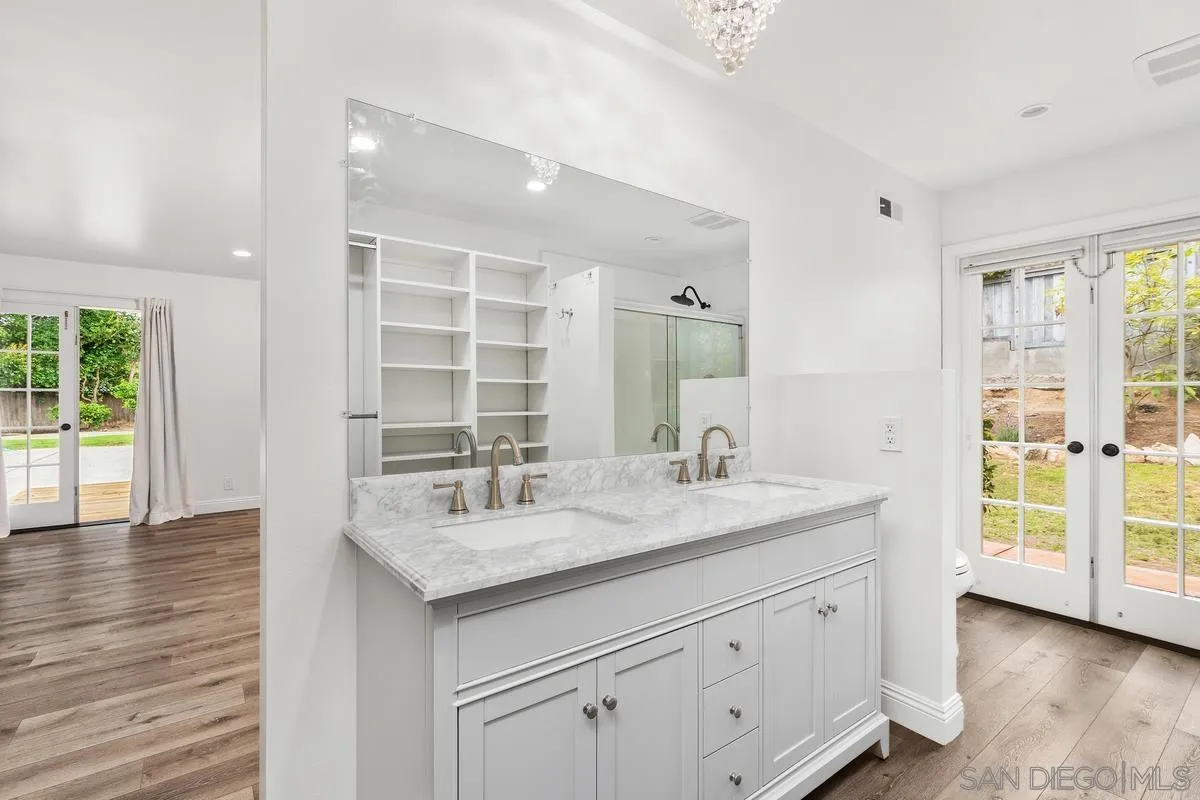 6229 La Jolla Mesa Drive La Jolla, CA 92037 - Photo 27 of 39 a bathroom with a sink double vanity and a shower