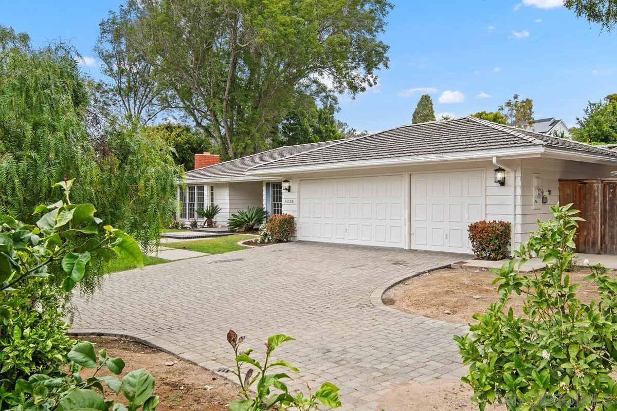 6229 La Jolla Mesa Drive La Jolla, CA 92037 - Photo 4 of 39 a front view of house with yard and trees around