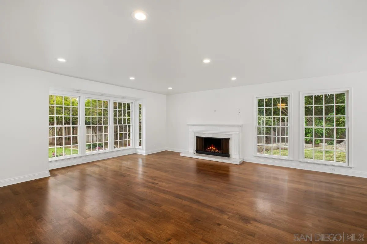 6229 La Jolla Mesa Drive La Jolla, CA 92037 - Photo 8 of 39 a view of an empty room with wooden floor and a window