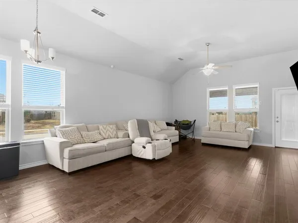 a living room with furniture and a large window
