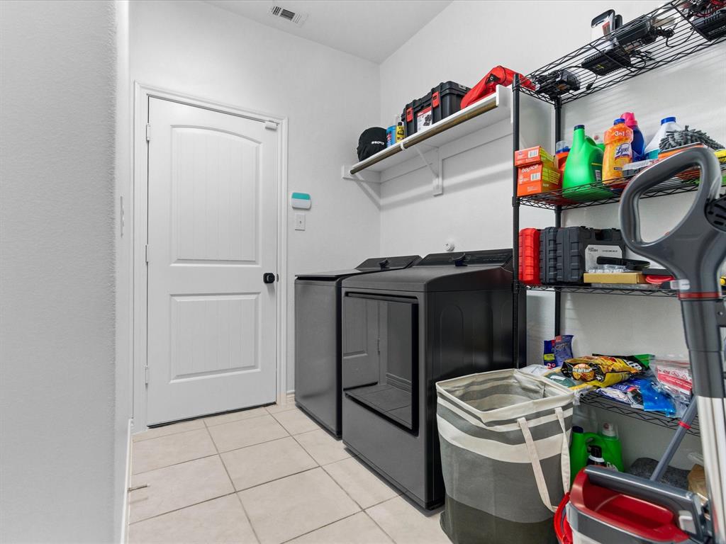 120 Garner Court Forney, TX 75126 - Photo 25 of 27 a utility room with dryer and washer