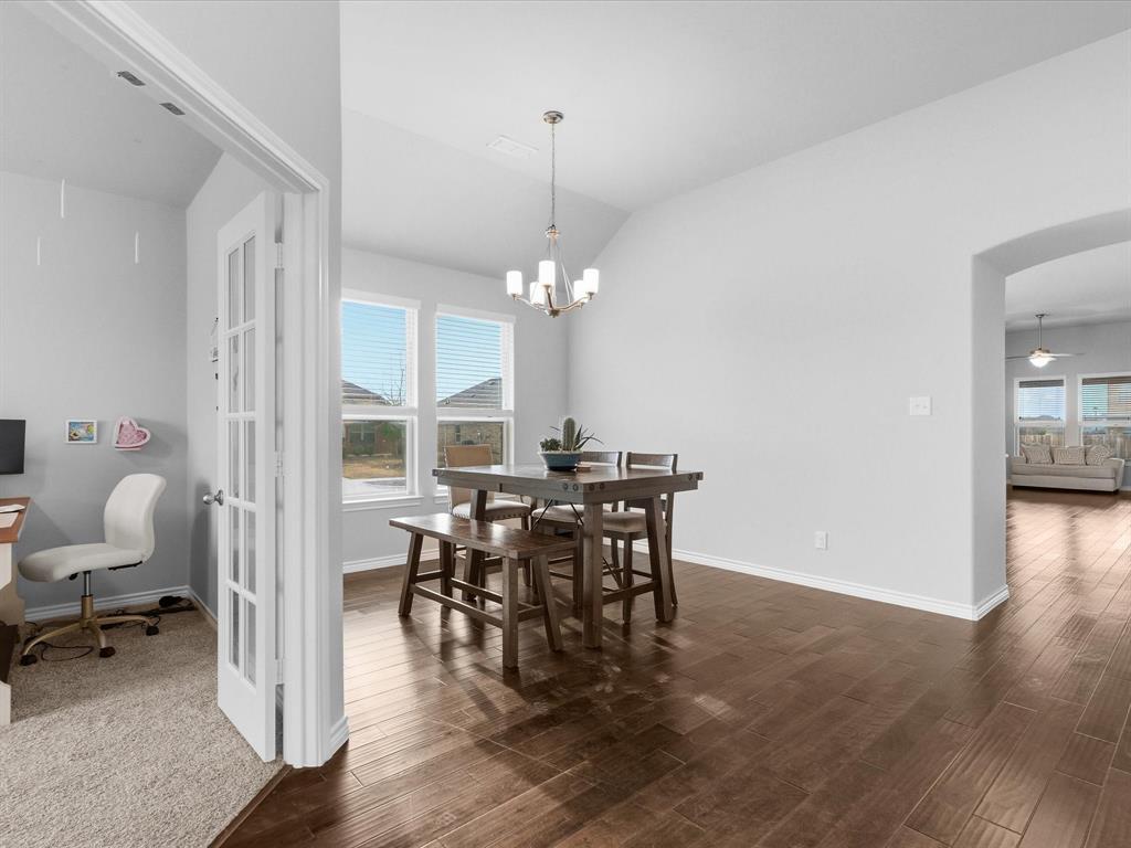 120 Garner Court Forney, TX 75126 - Photo 4 of 27 a view of a dining room with furniture and wooden floor