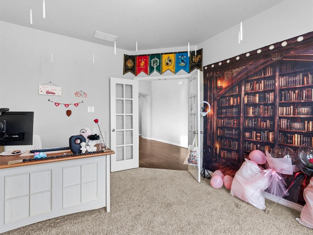 120 Garner Court Forney, TX 75126 - Photo 6 of 27 a bedroom with furniture and a flat screen tv