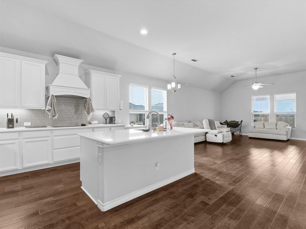 120 Garner Court Forney, TX 75126 - Photo 8 of 27 a large white kitchen with lots of counter space and a sink