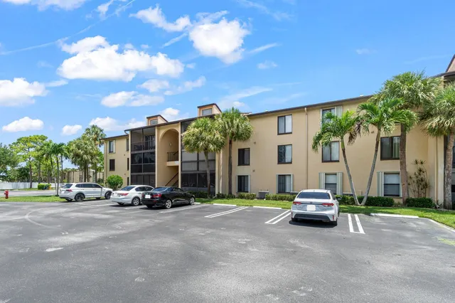 a view of a car parked in front of a building