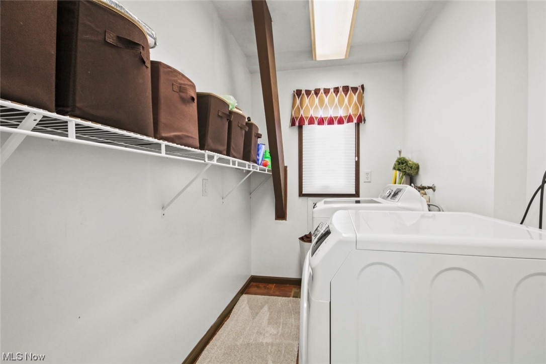 7550 South Raccoon Road Canfield, OH 44406 - Photo 21 of 32 Laundry room featuring washing machine and clothes dryer and light colored carpet