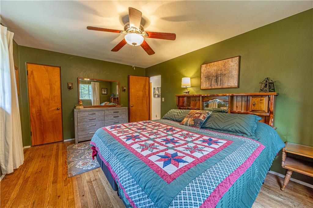 1194 Donnellville Road Natrona Heights, PA 15065 - Photo 11 of 20 a bedroom with a bed dresser and a flat tv screen